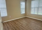 Thumbnail 6 of 66 - A room with light brown wooden flooring and white blinds on the windows at The Greyson, Ohio, 