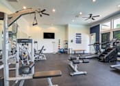 Thumbnail 32 of 53 - A spacious home gym with a variety of exercise equipment at Sovereign at Overland Park Apartments, Overland Park, 66213