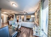 Thumbnail 21 of 38 - Living Room Come Kitchen View at Waterstone at Cinco Ranch, Katy, 77450