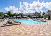Thumbnail 16 of 40 - Pool Along with sitting area at Waterstone at Cinco Ranch Apartments, Katy, 77450