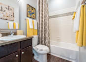 Thumbnail 15 of 40 - Bathroom with wooden storage at Waterstone at Cinco Ranch Apartments, Katy, TX 77450