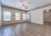 Thumbnail 40 of 40 - A room with a ceiling fan and wooden flooring at Waterstone at Cinco Ranch Apartments, Katy, 77450