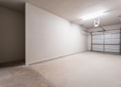 Thumbnail 7 of 40 - A room with a white wall and a metal shelf  at Waterstone at Cinco Ranch Apartments, Katy