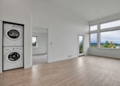 Thumbnail 22 of 52 - The 72nd Apartments | Living Area & Laundry