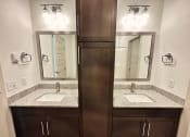 Thumbnail 33 of 46 - a bathroom with two sinks and two mirrors