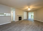 Thumbnail 2 of 36 - Three Bedroom | Living Room with Fireplace and Patio
