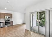 Thumbnail 52 of 59 - A modern kitchen with wooden floors and stainless steel appliances.