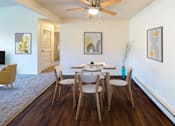 Thumbnail 2 of 30 - a dining room with a table and chairs and a ceiling fan
