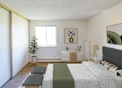 Thumbnail 4 of 30 - a bedroom with a bed and a dresser and a window