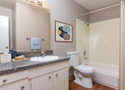 Thumbnail 7 of 34 - a bathroom with a sink toilet and a bath tub