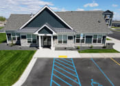 Thumbnail 43 of 46 - a house with a parking lot with blue arrows in front of it
