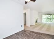 Thumbnail 11 of 24 - A room with a ceiling fan and a window with blinds.