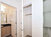 Thumbnail 17 of 24 - A white door is open to a hallway.