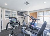 Thumbnail 7 of 56 - the gym has cardio equipment and a flat screen tv