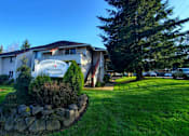 Thumbnail 8 of 26 - A house with a sign that says "Garden Home Crossing".