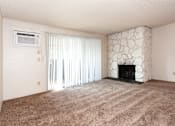 Thumbnail 3 of 40 - an empty living room with a fireplace and a window