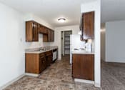 Thumbnail 1 of 40 - a kitchen with wooden cabinets and a white refrigerator