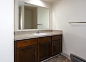 Thumbnail 7 of 40 - a bathroom with a sink and a mirror