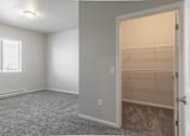 Thumbnail 4 of 48 - an empty bedroom with a closet and a window