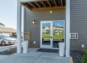 Thumbnail 17 of 48 - the view of the front entrance of a building with glass doors