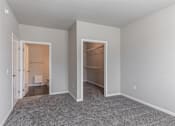 Thumbnail 5 of 48 - a bedroom with a closet and a door to a bathroom