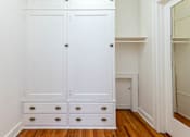 Thumbnail 19 of 52 - A white wardrobe with four drawers is in a room.