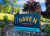 Thumbnail 50 of 50 - A sign for Haven in Lake Oswego stands in front of a landscaped area.