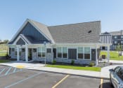 Thumbnail 22 of 46 - the front of a house with a parking lot