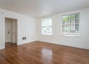 Thumbnail 43 of 52 - A room with a wooden floor and a window.