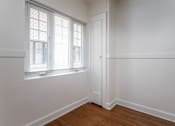 Thumbnail 44 of 52 - A room with a window and a door.