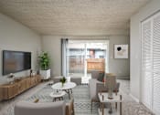 Thumbnail 4 of 56 - A living room with a flat screen TV on the wall.
