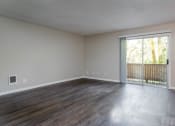 Thumbnail 15 of 27 - Vantage at Hillsdale | #3 Spacious Living Room, Plank Style Flooring and Entrance to Patio