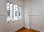 Thumbnail 30 of 52 - A room with a window and a door.