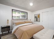 Thumbnail 4 of 24 - a bedroom with a bed and a window