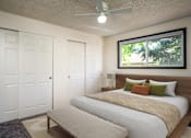 Thumbnail 6 of 24 - a bedroom with a bed and a window