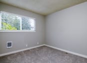 Thumbnail 8 of 20 - The Hideaway | Bedroom with Wall to Wall Carpet and light filled window
