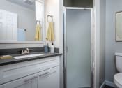 Thumbnail 8 of 27 - a bathroom with a sink toilet and a shower