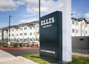 Thumbnail 9 of 45 - a building with a sign in front of it