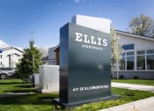 Thumbnail 7 of 45 - a sign for ellis apartments in front of a building