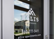 Thumbnail 10 of 45 - a window with the apartments logo on it