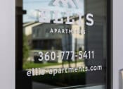 Thumbnail 8 of 45 - a glass door with the logo apartments on it