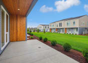 Thumbnail 22 of 45 - the outlook of the yards and buildings at ellis townhomes
