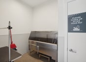 Thumbnail 35 of 45 - a kitchen with a stainless steel counter and a glass door
