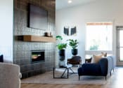 Thumbnail 3 of 45 - a modern living room with a fireplace and tv