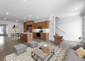 Thumbnail 12 of 45 - a living room with a couch and a table