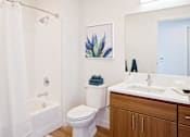 Thumbnail 10 of 36 - Bathroom with single vanity and bath tub/shower