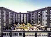 Thumbnail 2 of 36 - Aerial photo of building view from the west of courtyard and apartments