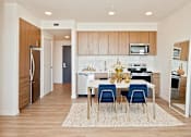 Thumbnail 9 of 36 - Interior of one bedroom with dining room and kitchen area