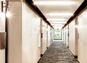 Thumbnail 15 of 36 - Hallway with LED sconces at each door