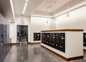 Thumbnail 22 of 36 - Mail room with package lockers and mailboxes
